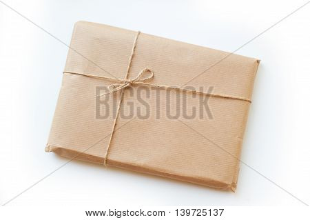envelope kraft paper tied with string on a white background.