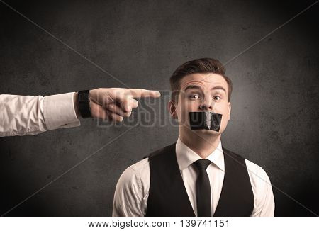 Caucasian business hand pointing at subordinate male employe