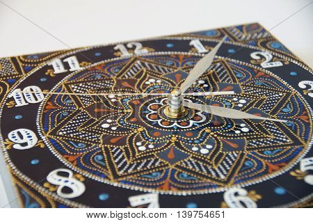 blue square hand-painted watch with contour acrylic paints in the technique point to point, with a geometric pattern in the form of a mandala, white numerals and silver arrows