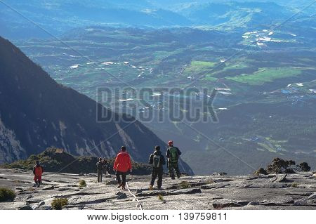 Ranau,Sabah,Borneo-March 13,2015:Group of climbers move down from Low's Peak to Sayat-Sayat check point at Mountain Kinabalu.Sabah