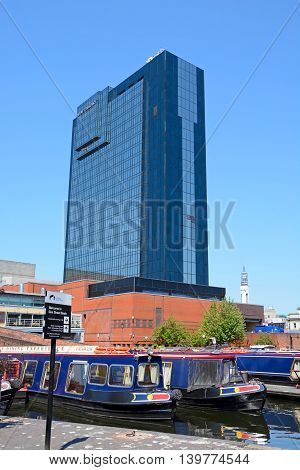 BIRMINGHAM, UNITED KINGDOM - JUNE 6, 2016 - Rear view of the Hyatt Hotel with narrowboats in the foreground at Gas Street Basin Birmingham England UK Western Europe, June 6, 2016.