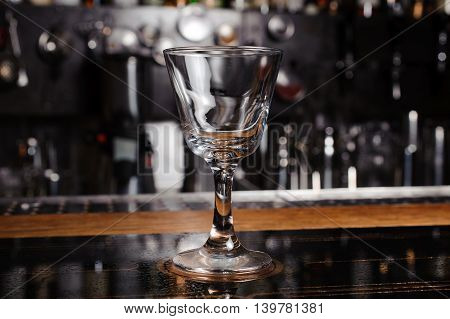 empty cocktail glass on the bar counter