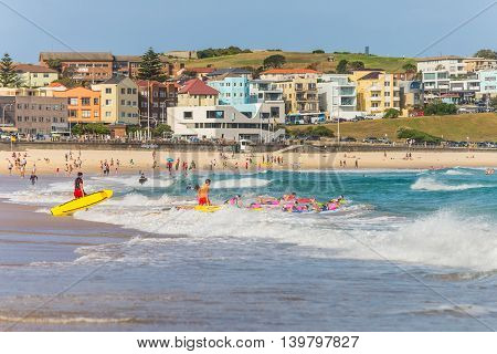 Sydney Australia - November 26 2014: Surfers in the waters of Bondi Beach. Bondi beach is one of the most famous places for surfing in Australia.