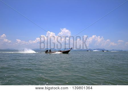 longtail boat runing on Phang Nga Bay go to Koh Panyee island