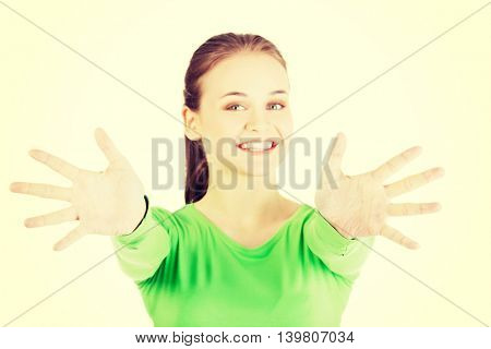 Attractive  woman with hands open in front oh her.