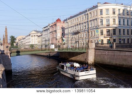 ST. PETERSBURG, RUSSIA - MAY 29, 2016: People on the tour boat in Griboyedov canal. River tours is the favorite leisure activity in the city with more than 50 rivers