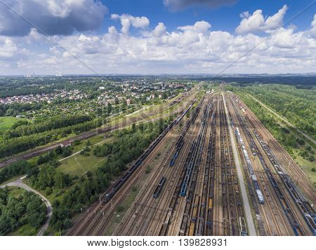 Depot With Many Railways At Day In City At Sunny Day. View From Above.