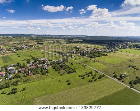 Rural Landscape With Green Hill And Blue Sky In Poland. View From Above.
