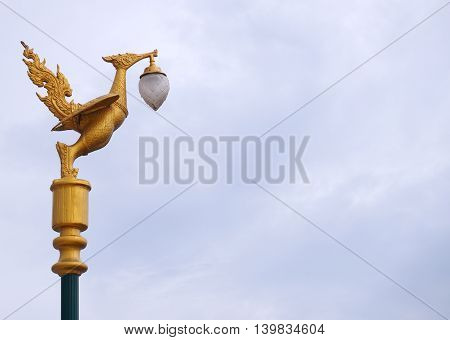 Golden swan electric lamp post on  in Thailand.