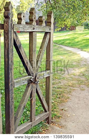 Vintage wooden rural gate in garden Pereiaslav-Khmelnytskyi Ukraine