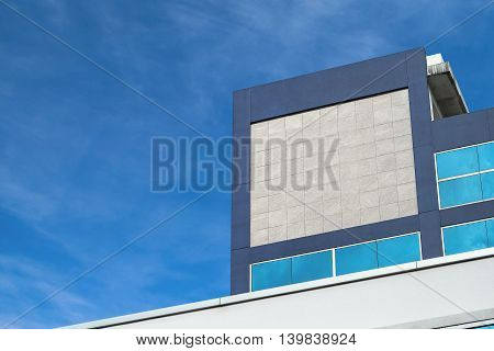 Mockup Company logo or signage blank space Granite Texture on building in the city.