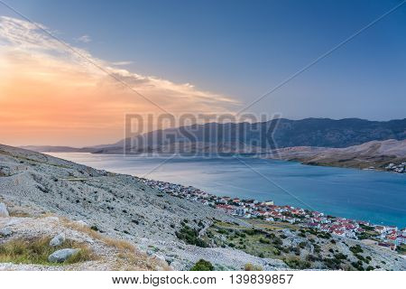 Aerial view on Island of Pag in sunset summertime, touristic destination in Croatia, with town of Pag in downtown.