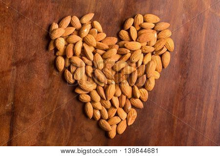 Almond heart shaped over a wooden table