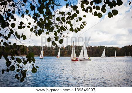 Trakai Lithuania - October 15 2011: Sailing ship yachts with white sails during annual regatta on Galve lake on 15 October 2011 inTrakai Lithuania.