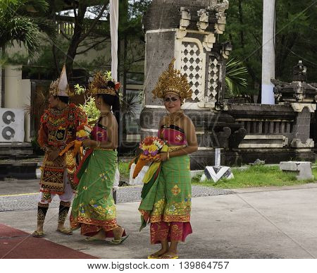Port Benoa Bali Indonesia--Feb 28 2016 Dancers in traditional Balinesian costumes greeting tourists at Port Benoa / Bali Indonesia