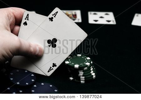 A hand of pocket aces in texas holdem.