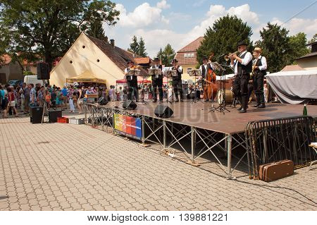 Buchlovice, Czech Republic, July 23, 2016: Celebration of garlic. Traditional farmers harvest celebrations of garlic. Agricultural sales markets. Sales of garlic, performances by folk ensembles.