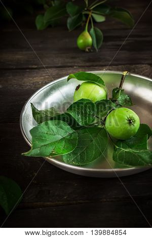 Fresh Green Apples With Leaves On Dark Rusric Background.