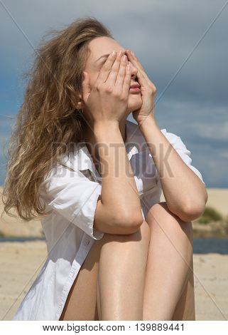 Young beautiful and sexy woman relaxing on a summer beach