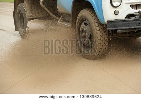Sweeper Cleans Dirt Road