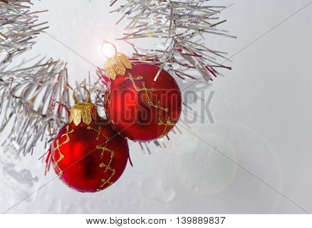 bright Christmas balls with reflections and colored tinsel