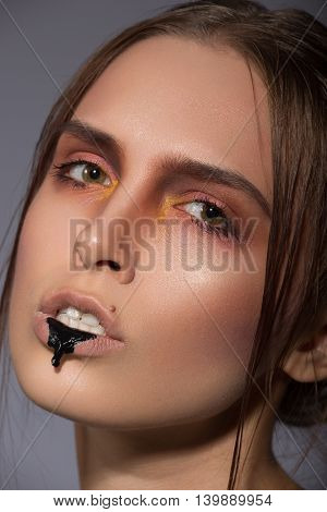 beauty creative makeup with black dribble lips