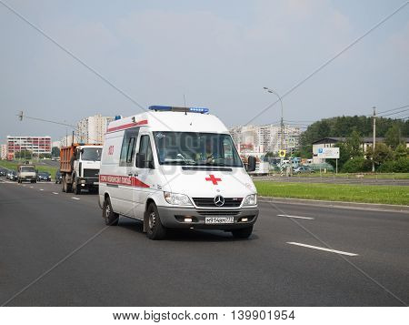 July 2016, Moscow, Russia. Emergency with the included flasher racing in traffic on the street Polyany in the district of Butovo
