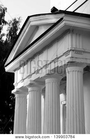 Pediment of Fragment of Church of St. Alexander Nevsky in Ust-Izhora town St.Petersburg suburb Russia. Black and white.