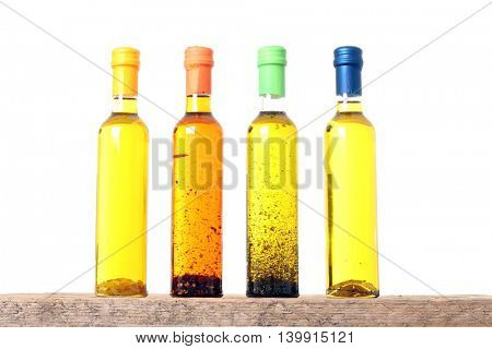 Bottles of extra virgin olive oil infused with mediterranean herbs.