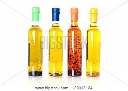 Bottles of extra virgin olive oil infused with mediterranean herbs. 