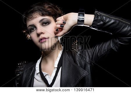 Fashionable depiction of wearable tech smart watch on a punk rock female model