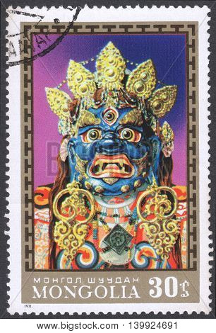 MOSCOW RUSSIA - CIRCA FEBRUARY 2016: a post stamp printed in MONGOLIA shows a traditional Mongol mask the series 