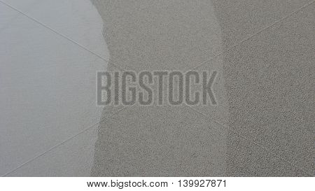 Three grey lines in sand abstract background