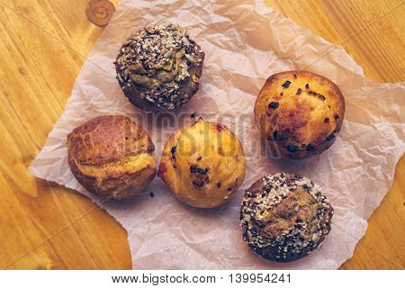 Homemade salty muffins also called proja pie top view of traditional Balkans baked food with savory cheese ham eggs and paprika made of corn flour starch selective focus.