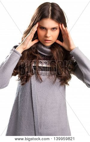 Lady touches head with fingers. Gray sweater with a pattern. Irritated and angry. Don't push on me.