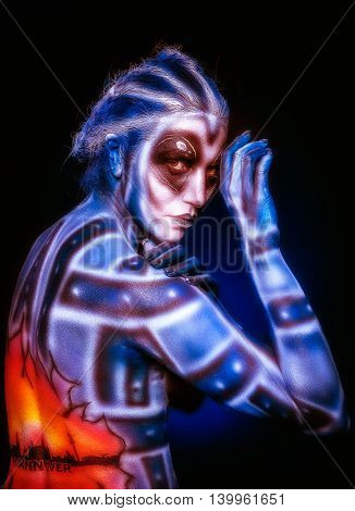 Creative body art. Mystical surreal alien woman.