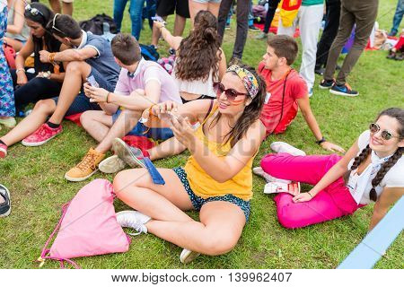 Poznan POLAND - JULY 24 2016: pilgrims resting during Days In Dioceses just before The World Youth Day in Krakow; WYD is a meeting of youth from all over the world