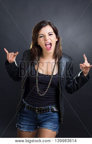 Image of a brunette rock woman posing