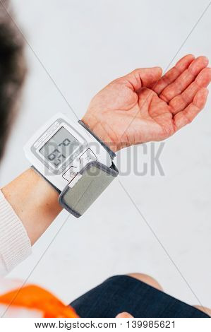 Unknown person with hand tensiometer - isolated on white