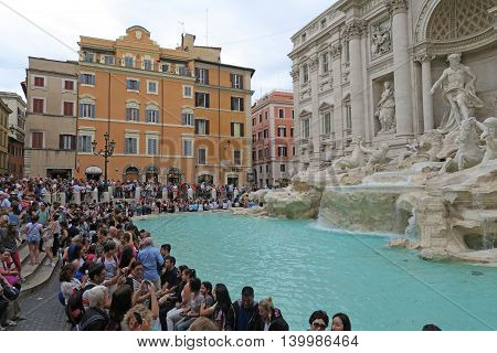 Rome, Italy 17 June 2016. Tourists at the renovated Fontana di Trevi. The Trevi fountain, after its renovation, gathers daily large crowds. Tossing a coin here will make you return to Rome.
