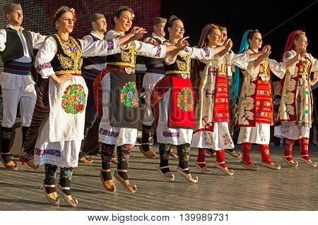ROMANIA TIMISOARA - JULY 7 2016: Young Serbian dancers in traditional costume perform folk dance during " International Festival of hearts " organized by the City Hall Timisoara.