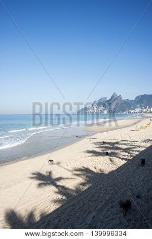 Ipanema Beach, Rio De Janeiro, Brazil - Scenic View With Two Brothers Mountain And Shadow Of Palm Tr
