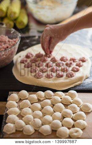 sculpt a dumplings on black wooden table