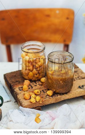 Raspberries Jam. Female Hand Making Jam, On A Rustic White Table