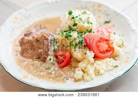 Polish Dish Bitki Wolowe With Sauce, Smashed Potatoes With Parsley And Tomato.