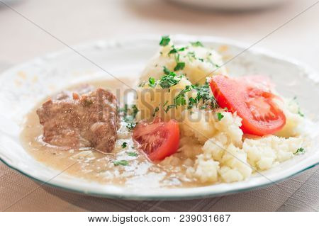 Polish Dish Bitki Wolowe With Sauce, Smashed Potatoes With Parsley And Tomato.
