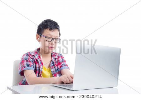 Young Asian Boy Wearing Headset And Using Laptop Computer Over White Background