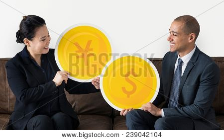 Business people with currency icons