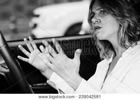 Frustrated woman stuck in a traffic