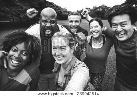 Group of cheerful diverse friends in the park